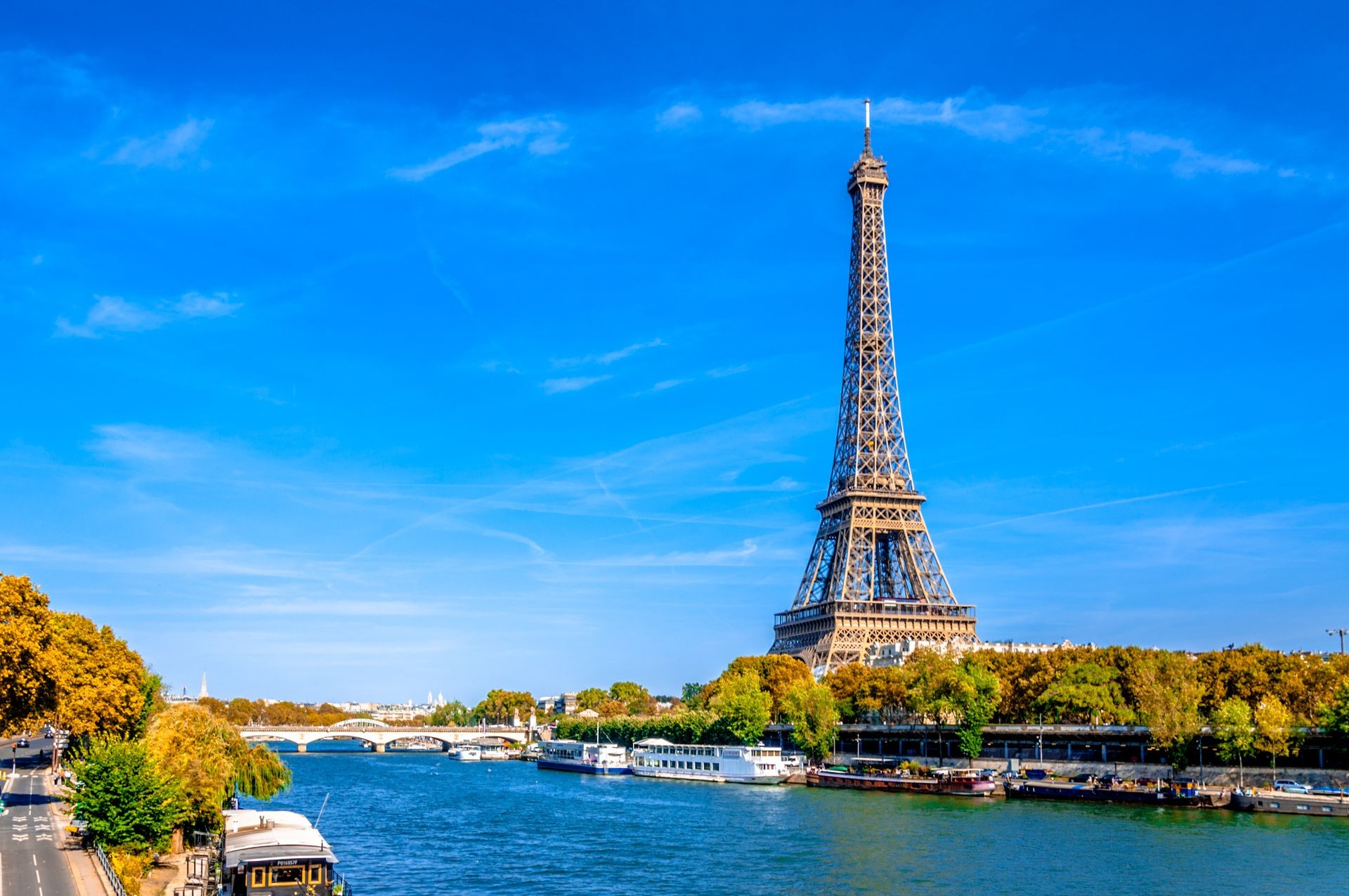 Panoramic view of Paris with the Eiffel tower and the River Seine in a sunny day at autumn.